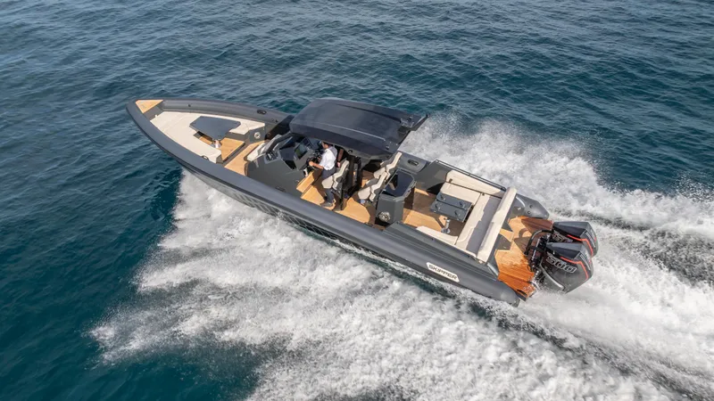 Slide: The Image of Skipper-BSK 38 boat cruising on open water, 2025 model. - 34