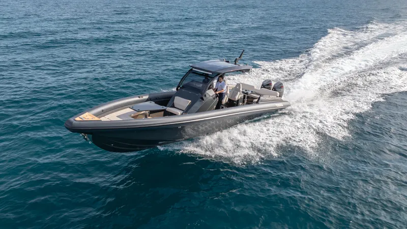 Slide: The Image of 2025 Skipper-BSK 38 boat cruising on open water, showcasing sleek design and powerful performance. - 27