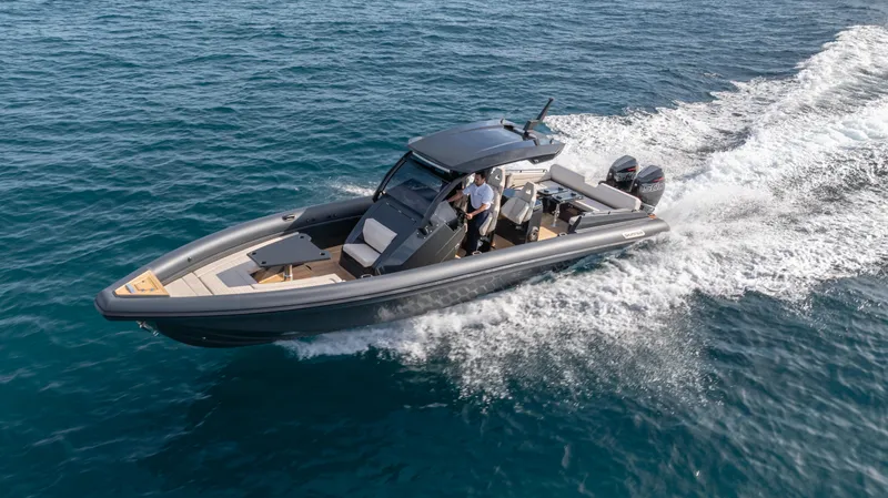 Slide: The Image of 2025 Skipper-BSK 38 boat cruising on open water, showcasing sleek design and performance. - 26