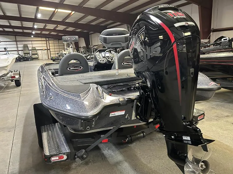 Slide: The Image of 2023 Triton 179 TrX boat with Mercury outboard motor in a showroom. - 9
