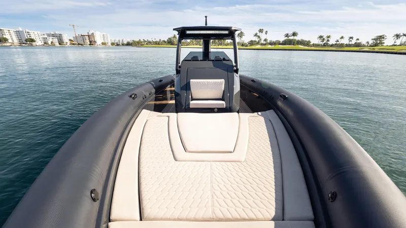 Slide: The Image of Luxury Skipper-BSK 38 boat, 2025 model, with sleek design on calm waters. - 7