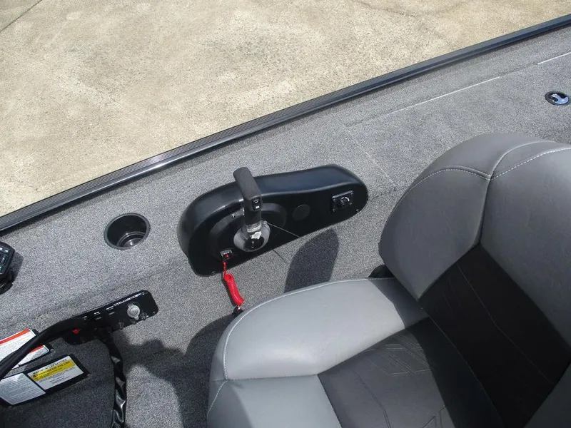 Slide: The Image of 2025 Tracker Panfish™ 17 boat interior with steering controls and seating. - 5