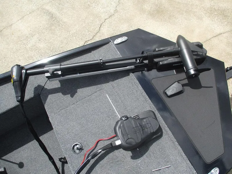 Slide: The Image of 2025 Tracker Panfish™ 17 boat deck with trolling motor and foot pedal controls. - 6