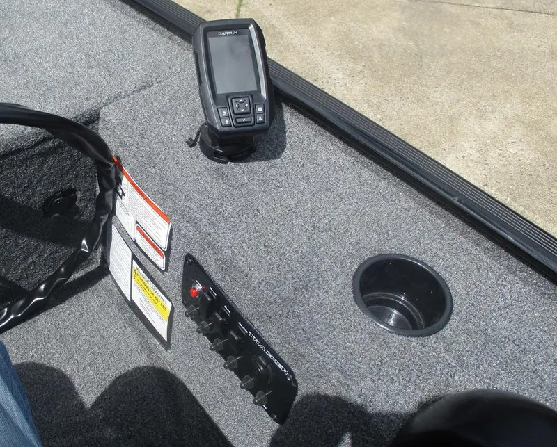 Slide: The Image of Interior of 2025 Tracker Panfish™ 17 boat with control panel and fish finder. - 7