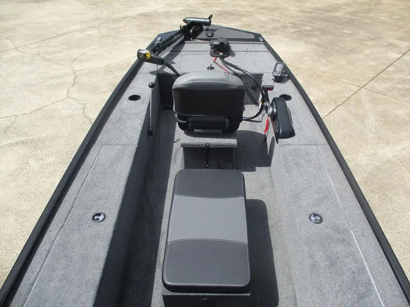 Slide: The Image of 2025 Tracker Panfish™ 17 boat interior with seating and steering console. - 8