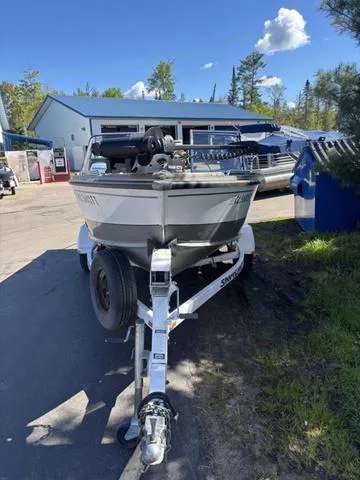 Slide: The Image of 2001 Lund 1700 Fisherman boat on trailer, parked outdoors near a building. - 3