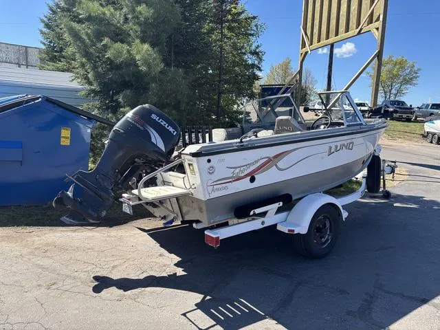 Slide: The Image of 2001 Lund 1700 Fisherman boat on trailer with Suzuki outboard motor. - 7