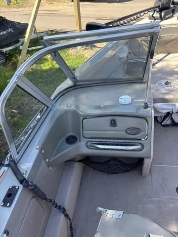Slide: The Image of 2001 Lund 1700 Fisherman boat interior with windshield and dashboard view. - 9
