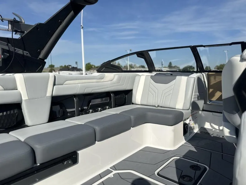 Slide: The Image of 2025 Malibu 25 LSV boat interior with sleek seating and modern design. - 20