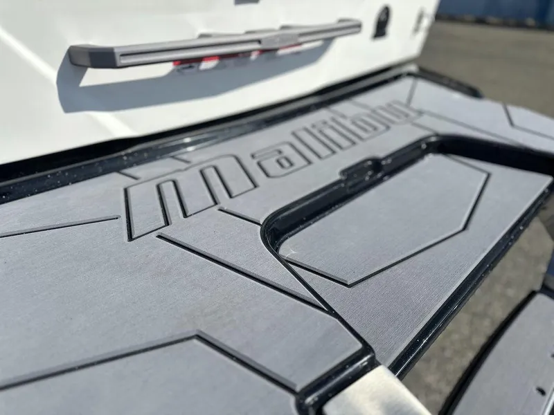 Slide: The Image of 2025 Malibu 25 LSV boat platform with embossed logo, close-up view. - 3