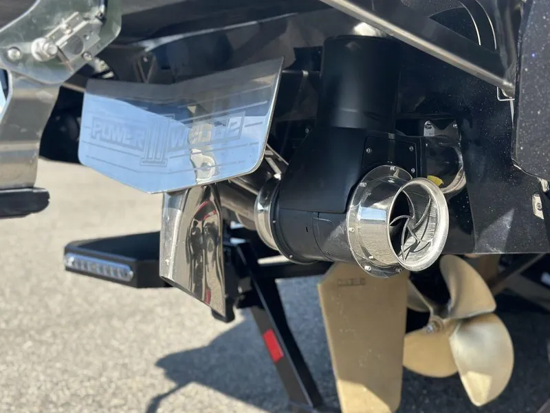 Slide: The Image of 2025 Malibu 25 LSV boat propeller and exhaust system close-up. - 4