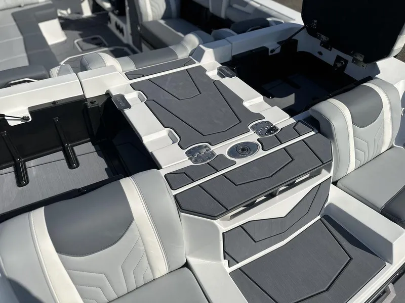 Slide: The Image of 2025 Malibu 25 LSV boat interior with sleek, modern seating and design. - 5