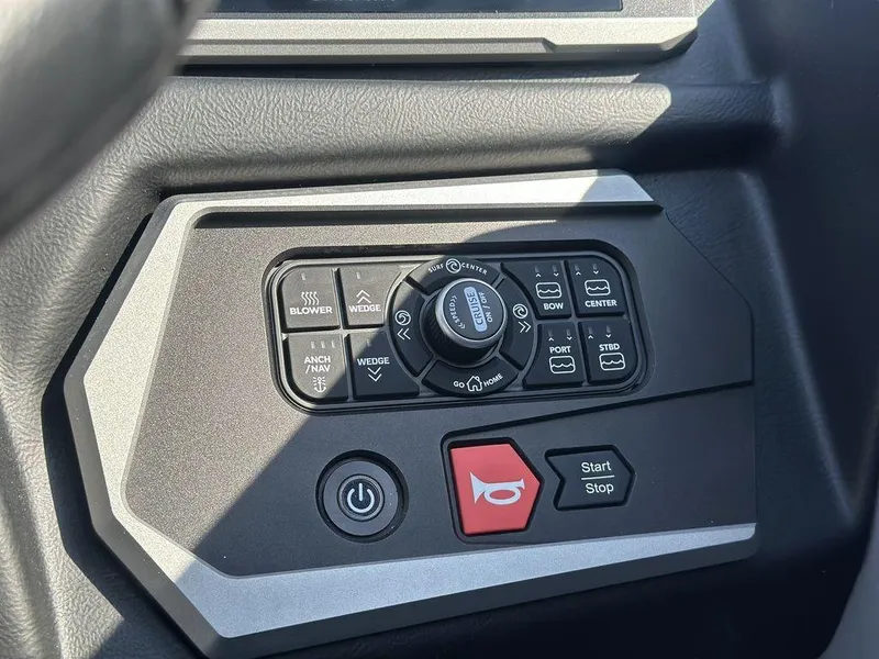 Slide: The Image of Control panel of 2025 Axis A225 boat with various function buttons and switches. - 20