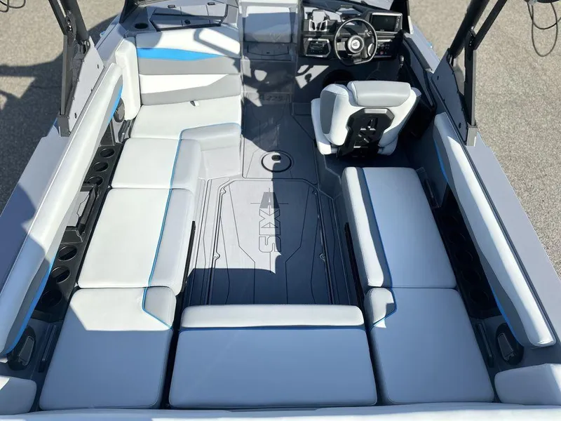 Slide: The Image of 2025 Axis A225 boat interior with sleek seating and modern dashboard design. - 4