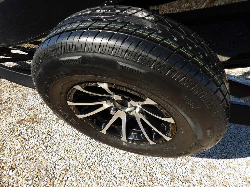 Slide: The Image of Close-up of a 2025 Lund 1975 Renegade SS tire on gravel surface. - 11