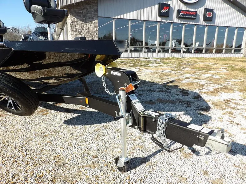 Slide: The Image of Trailer hitch of 2025 Lund 1975 Renegade SS boat on gravel lot. - 12