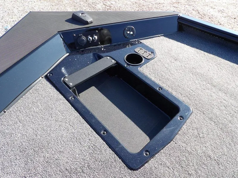 Slide: The Image of 2025 Lund 1975 Renegade SS boat interior with storage compartment and control panel. - 15