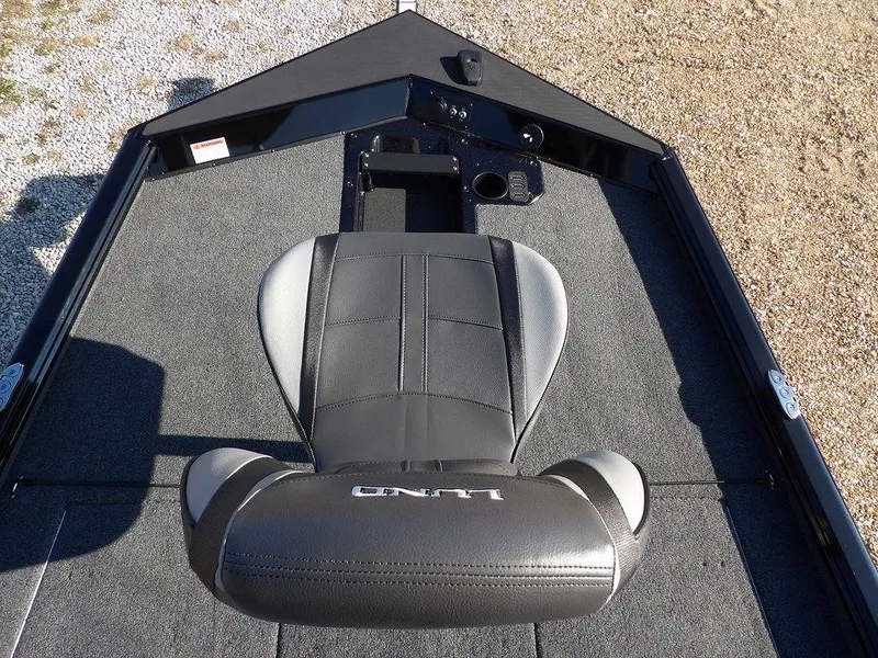 Slide: The Image of Lund 1975 Renegade SS 2025 boat interior with gray seating and carpeted deck. - 16