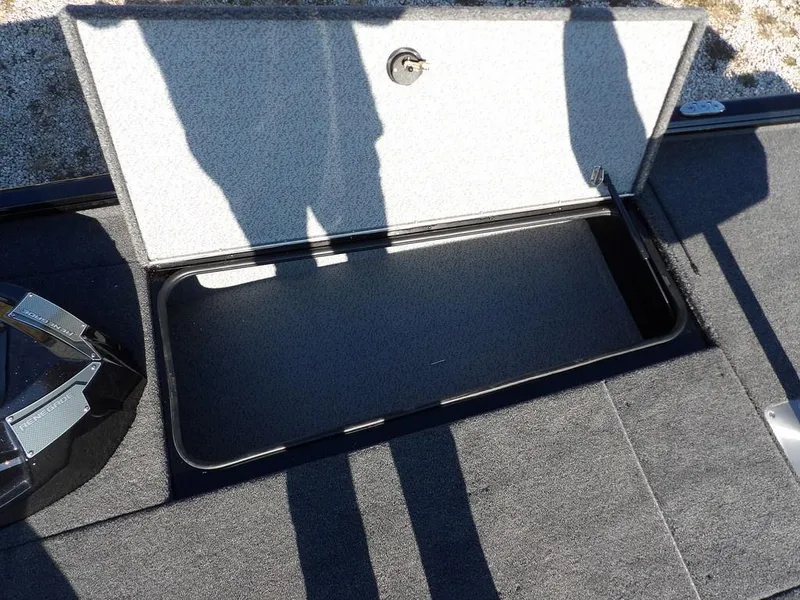 Slide: The Image of Open storage compartment on 2025 Lund 1975 Renegade SS boat deck. - 17