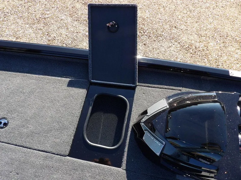 Slide: The Image of 2025 Lund 1975 Renegade SS boat interior with storage compartment and sleek design. - 19