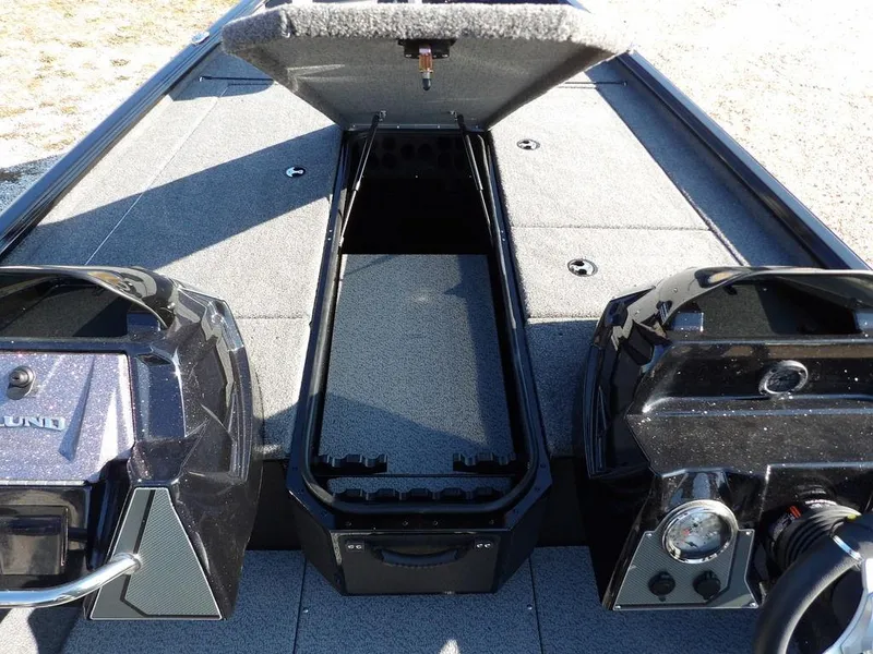 Slide: The Image of 2025 Lund 1975 Renegade SS boat interior with open storage compartment. - 21