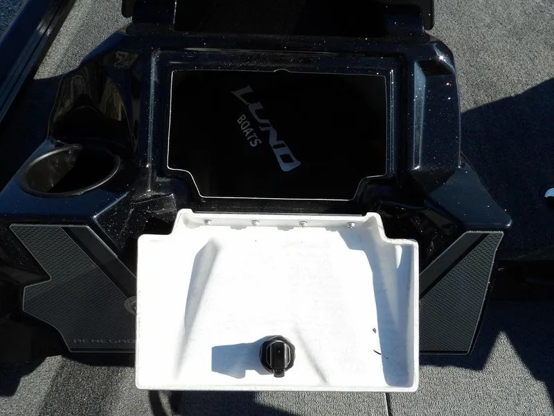 Slide: The Image of 2025 Lund 1975 Renegade SS boat console with open storage compartment. - 23