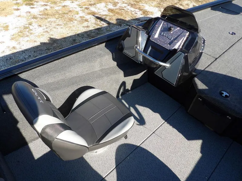 Slide: The Image of 2025 Lund 1975 Renegade SS boat interior with steering console and seat. - 25