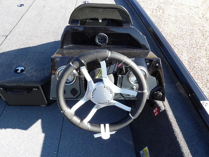 Slide: The Image of Steering console of 2025 Lund 1975 Renegade SS boat with modern design and controls. - 29