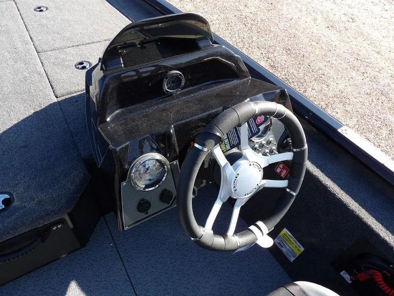 Slide: The Image of Steering console of 2025 Lund 1975 Renegade SS boat with modern controls. - 30