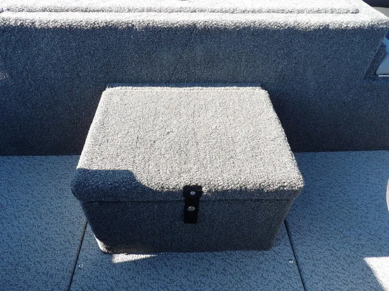 Slide: The Image of Gray carpeted storage box on 2025 Lund 1975 Renegade SS boat deck. - 35