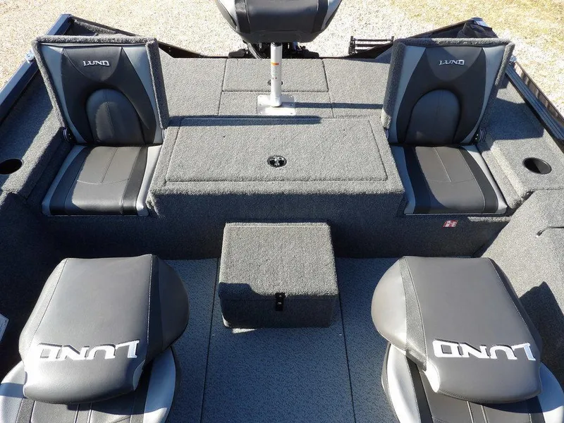 Slide: The Image of 2025 Lund 1975 Renegade SS boat interior with four cushioned seats and storage compartments. - 38