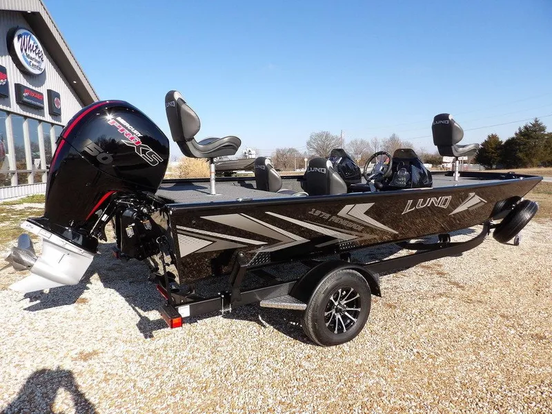 Slide: The Image of 2025 Lund 1975 Renegade SS boat with sleek design and powerful engine on display. - 43
