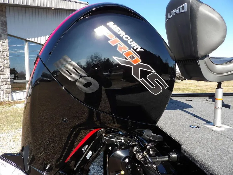 Slide: The Image of Mercury Pro XS engine on 2025 Lund 1975 Renegade SS boat, outdoor setting. - 5