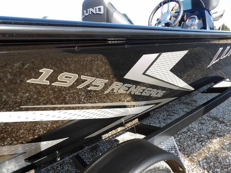 Slide: The Image of Lund 1975 Renegade SS boat, 2025 model, sleek black design with bold graphics. - 8