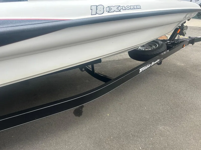 Slide: The Image of 2009 Triton 18 Explorer boat on trailer, side view. - 10