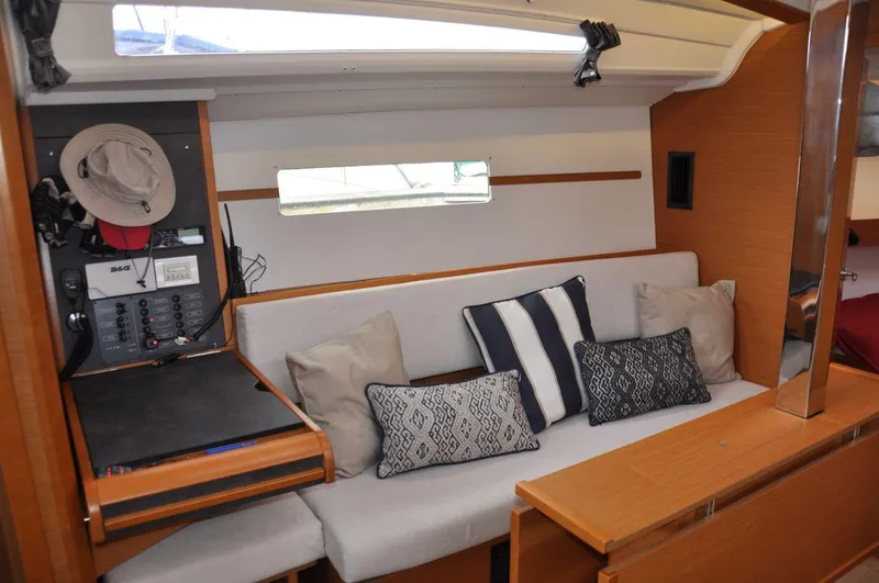 Slide: The Image of Interior of 2016 Jeanneau Sun Odyssey 349 sailboat with cozy seating and navigation equipment. - 26