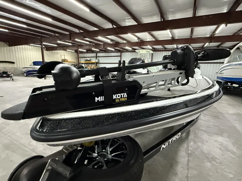 Slide: The Image of 2011 Nitro Z-7 boat with Minn Kota Ultrex motor in a storage facility. - 11