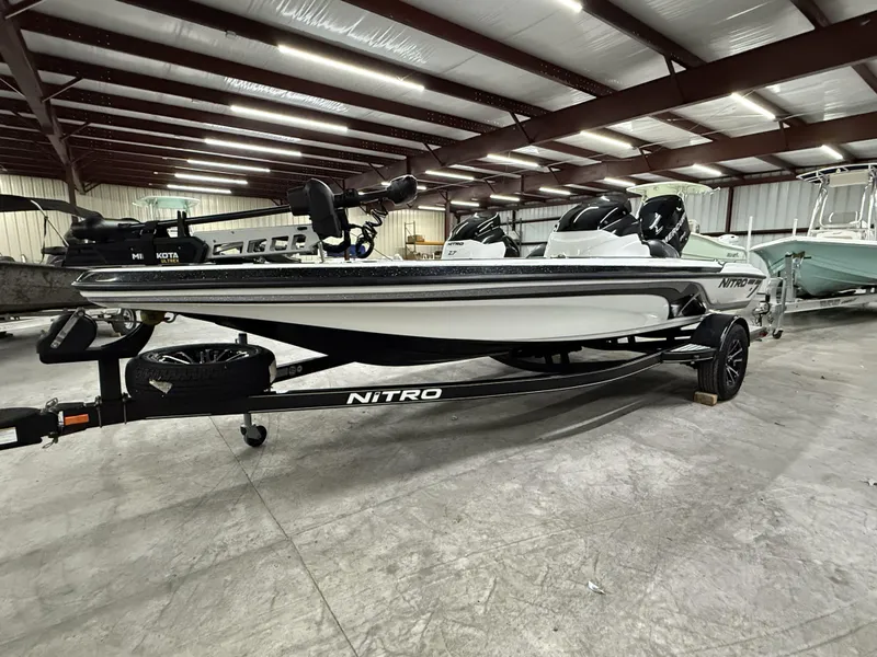 Slide: The Image of 2011 Nitro Z-7 boat in a warehouse, featuring sleek design and modern equipment. - 2