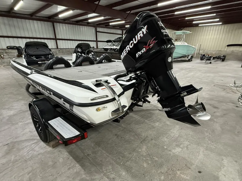 Slide: The Image of 2011 Nitro Z-7 boat with Mercury Pro XS engine in a warehouse setting. - 3