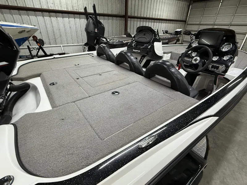 Slide: The Image of 2011 Nitro Z-7 boat interior with spacious deck and modern controls in a garage setting. - 4