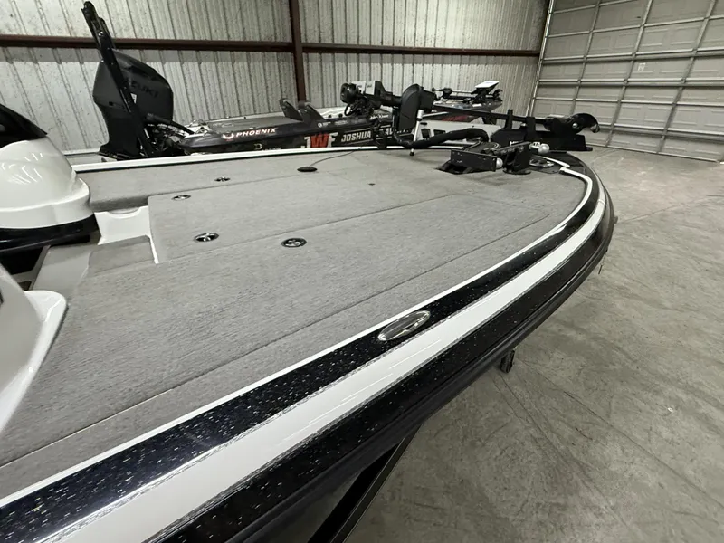 Slide: The Image of 2011 Nitro Z-7 boat in a garage, featuring a sleek design and spacious deck. - 5