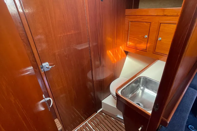 Slide: The Image of Interior of 1985 Contest 36S yacht with wooden cabinetry and compact sink. - 11