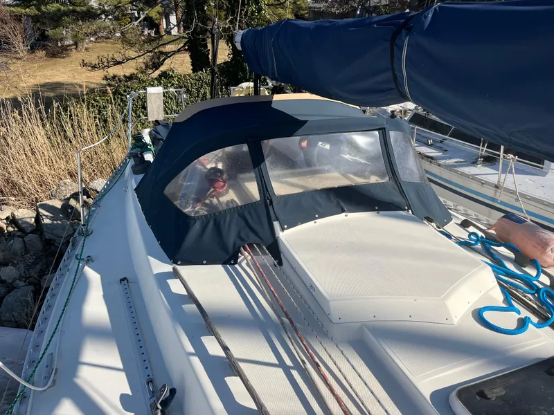 Slide: The Image of 1985 Contest 36S sailboat deck with blue canopy and rigging. - 15