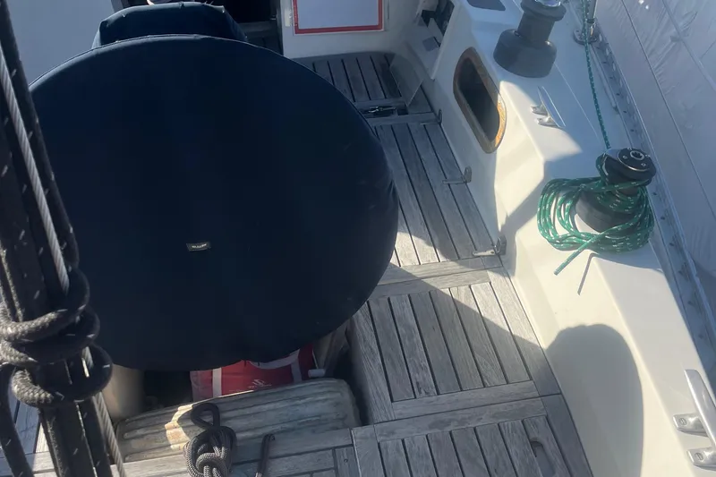 Slide: The Image of 1985 Contest 36S sailboat cockpit with wooden deck and nautical equipment. - 19