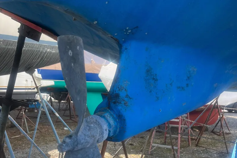 Slide: The Image of 1985 Contest 36S sailboat hull and propeller in dry dock. - 23