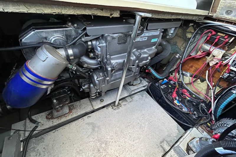 Slide: The Image of Engine compartment of a 1989 Fortier F-30 Hardtop boat, showcasing mechanical components. - 6