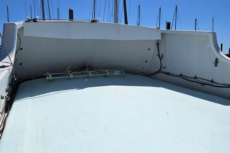 Slide: The Image of 1975 Trawler Monterey Diesel Cruiser deck with clear sky and marina background. - 15