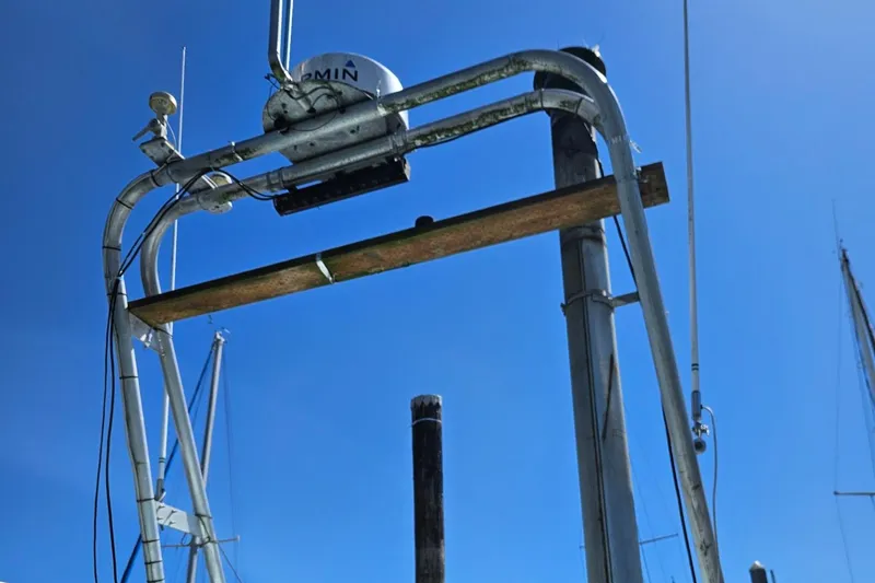 Slide: The Image of 1975 Trawler Monterey Diesel Cruiser radar arch against clear blue sky. - 27