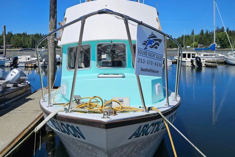 Slide: The Image of 1975 Trawler Monterey Diesel Cruiser docked at marina with sales sign. - 29