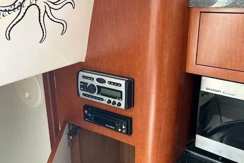 Slide: The Image of 2008 Boston Whaler 305 Conquest interior with radio and microwave. - 18